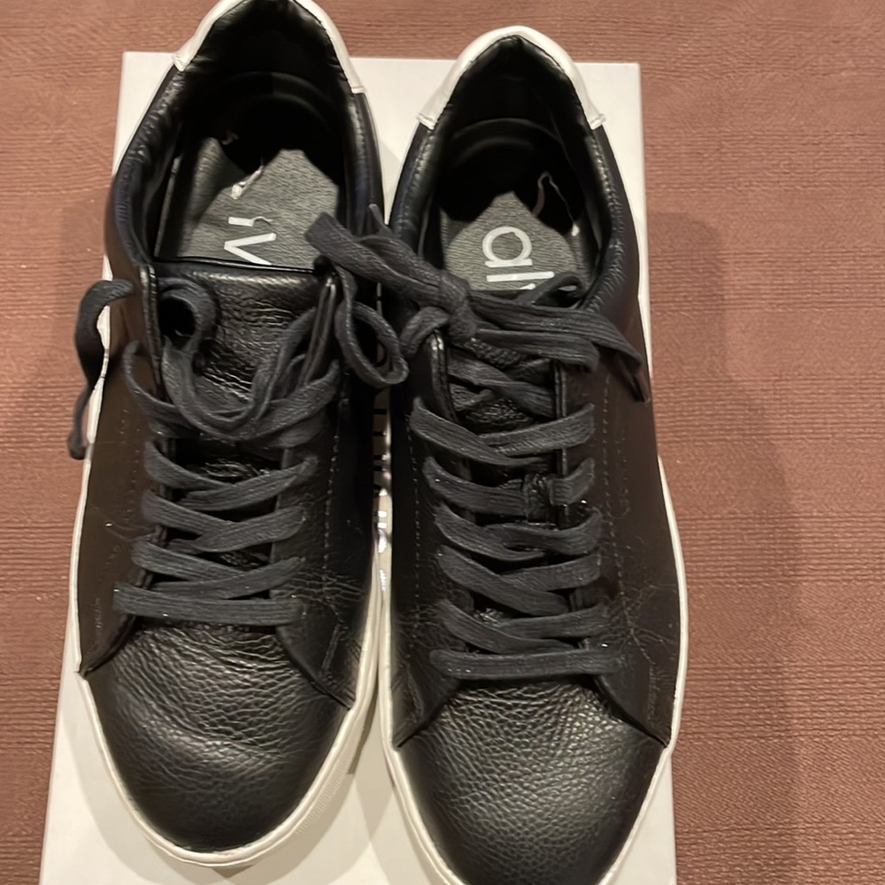 Only worn a few times. Calvin Klein black Falconi leather sneakers